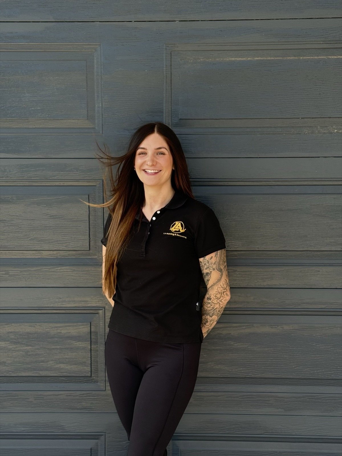 Lauren Brooks, Co-Owner and Business Operations Manager at LA Painting & Decorating, in branded uniform in Perth