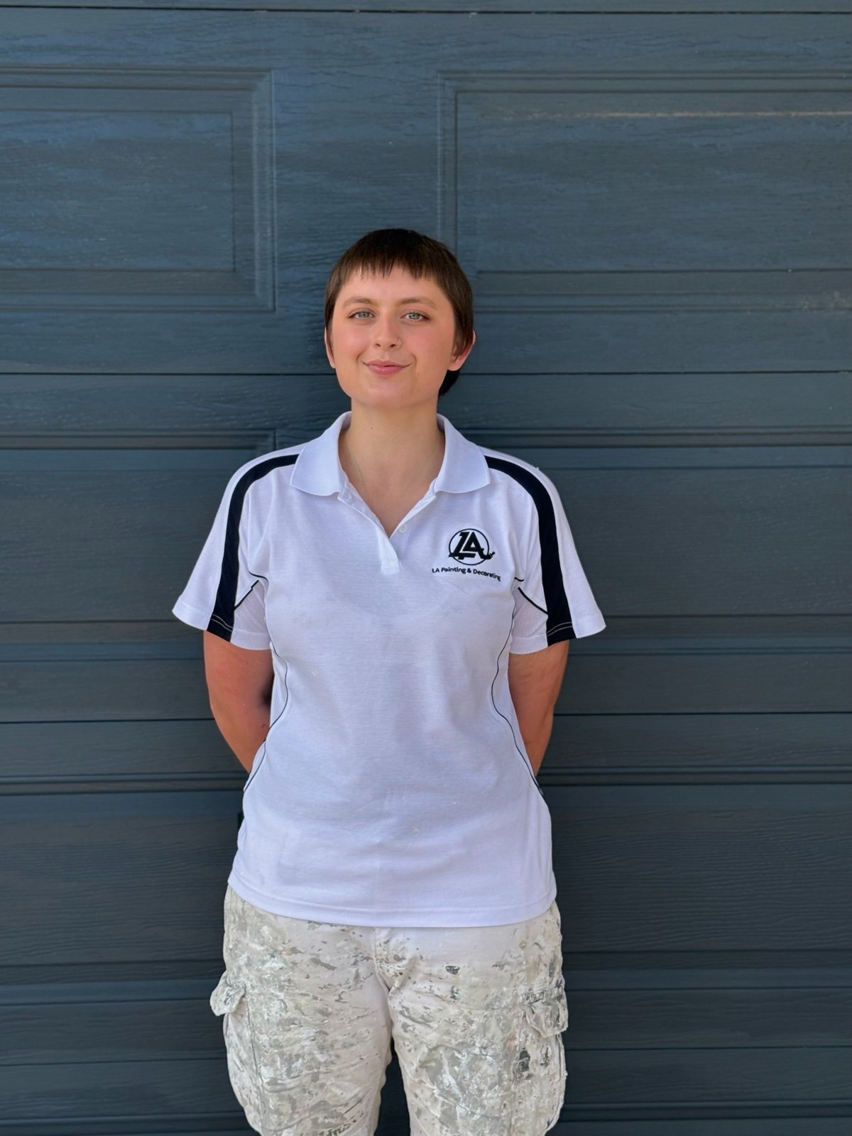 Savannah, qualified tradeswoman at LA Painting & Decorating, in branded uniform in Perth