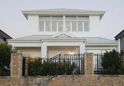 Two-storey white weatherboard home exterior repainted in Dulux Vivid White, LA Painting & Decorating, Perth